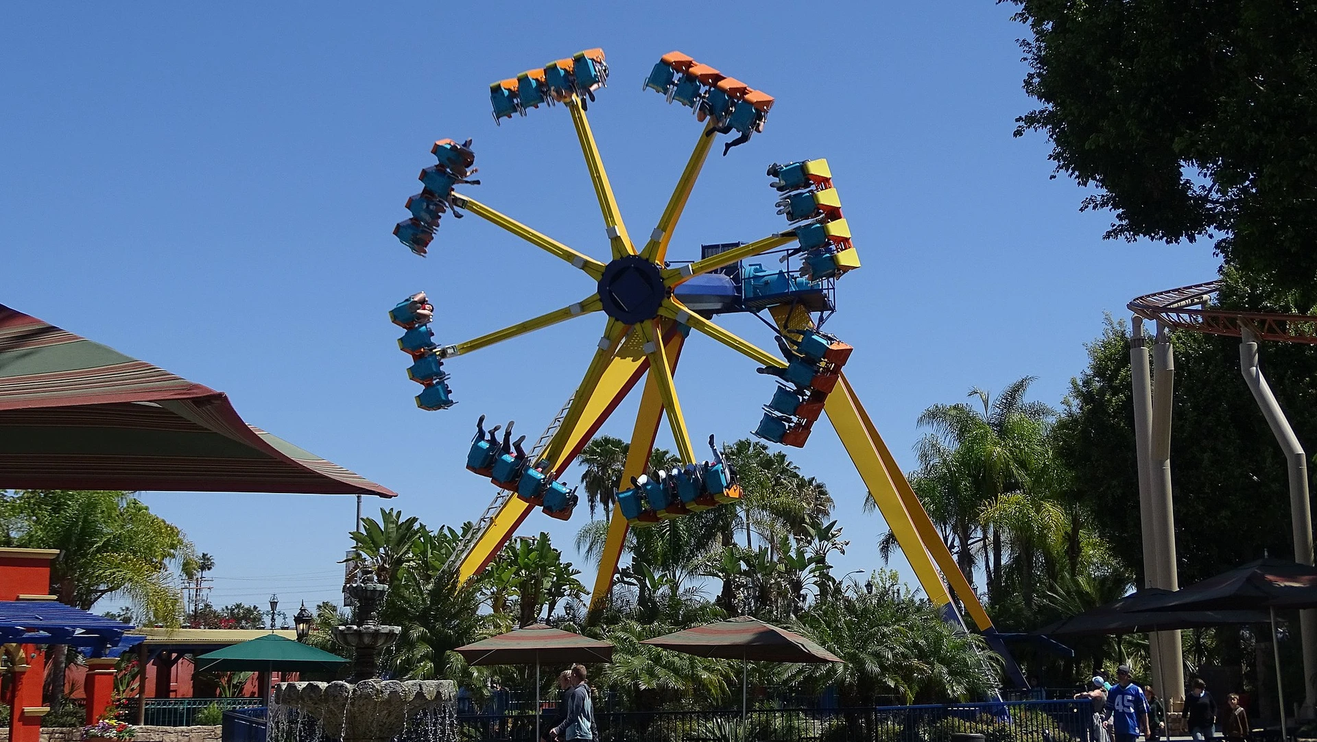 La Revolucion looks like a fast-spinning Ferris wheel with the wheel part swinging from horizontal to vertical.