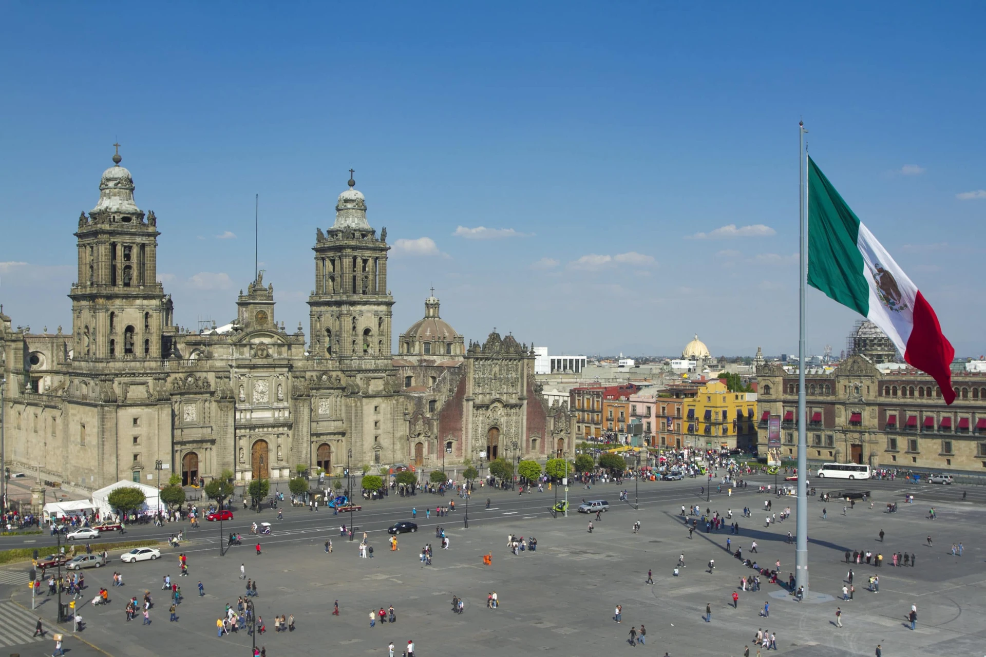 The Zocalo in Mexico City, with the cathedral and giant flag in the center.
