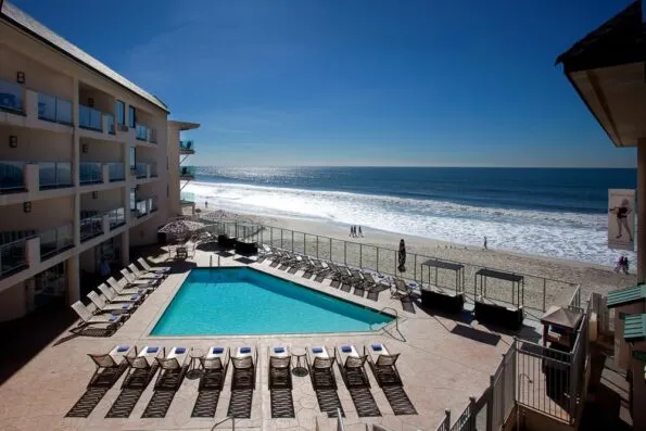 The pool at Beach Terrace Inn overlooks a tranquil beach.