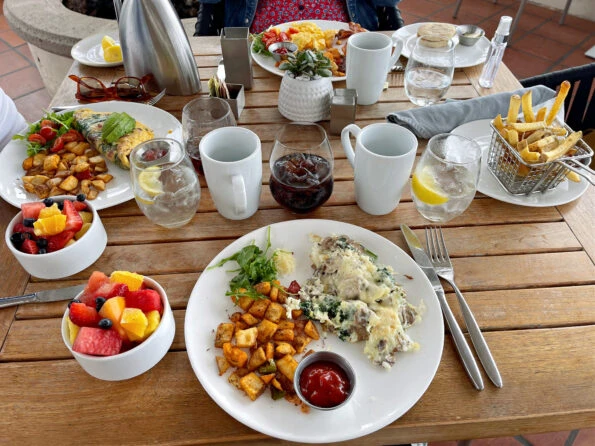 Breakfast egg entrees and sides on a wooden table at Covewood.