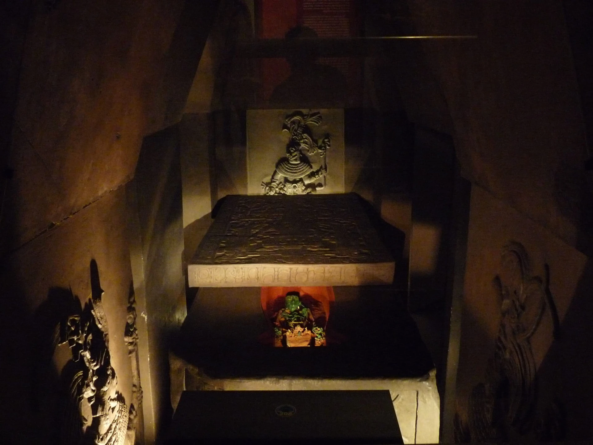 The recreation of Pakal's tomb under dim light.
