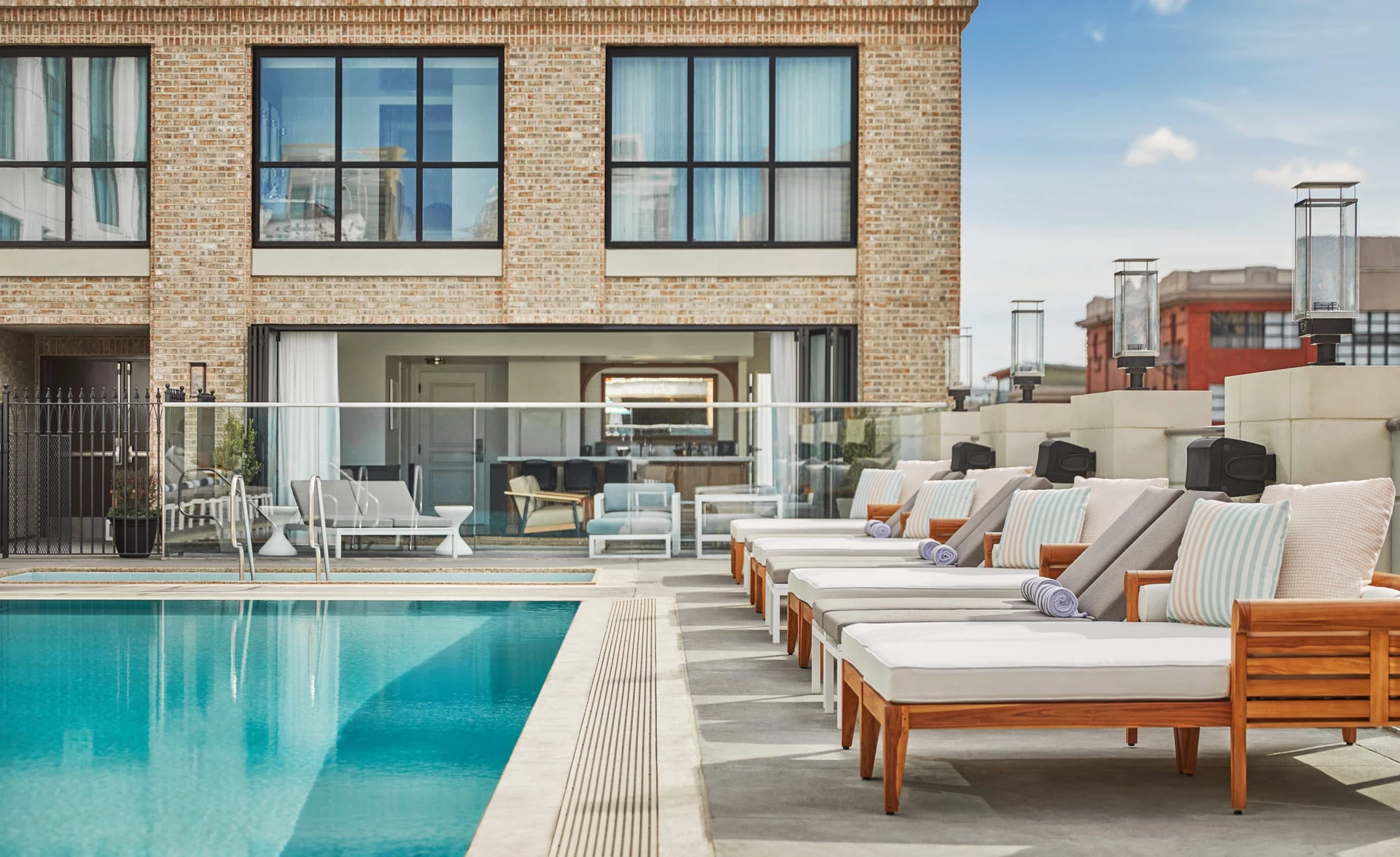 Plush lounge chairs by the pool at Pendry San Diego, one of our favorite boutique hotels.