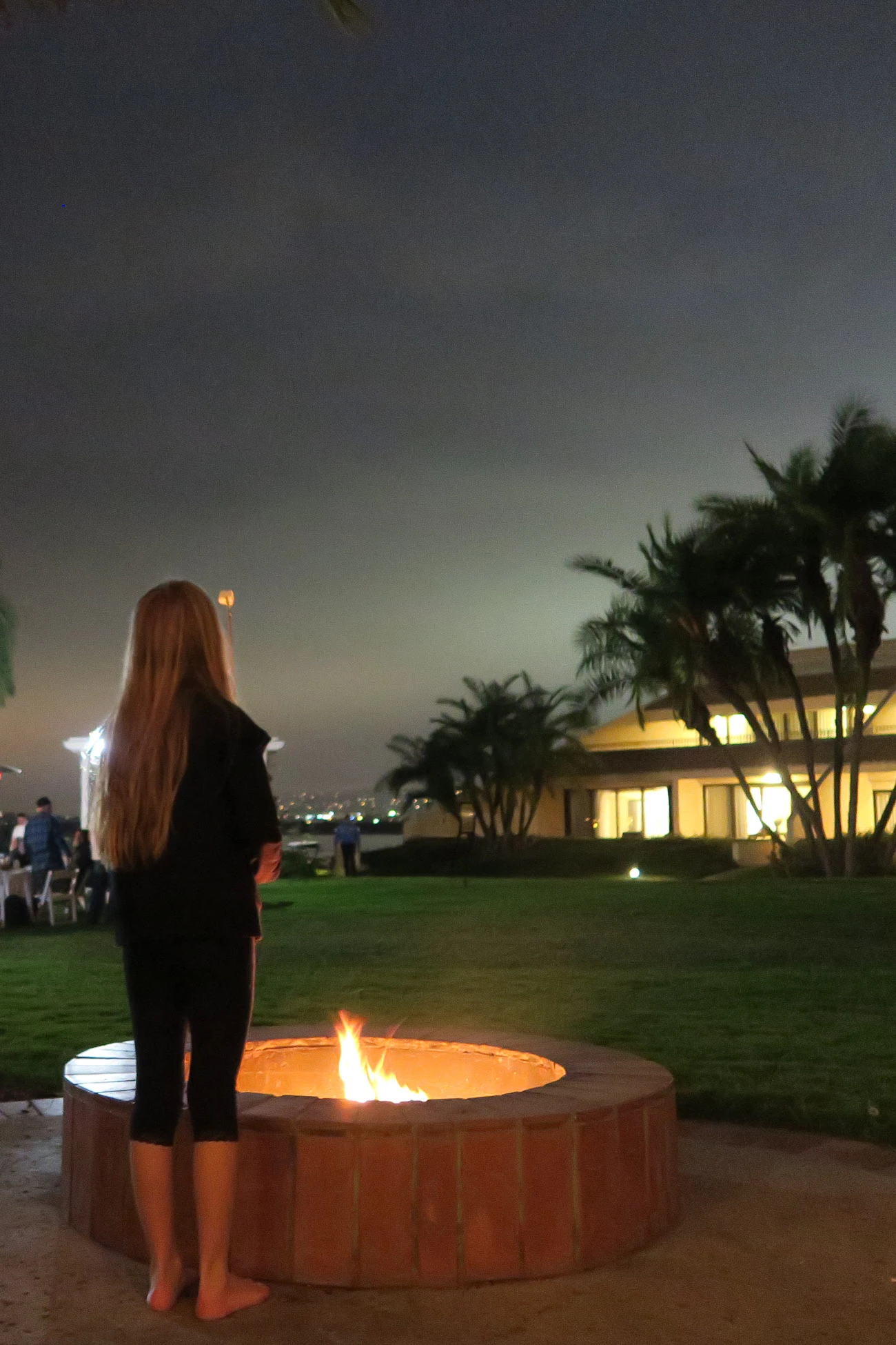 My daughter roasts s'mores in our fire pit room.