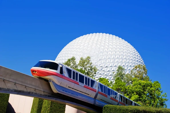 A monorail train passes by Spaceship Earth, the visual and thematic centerpiece of Epcot at Walt Disney World Resort.