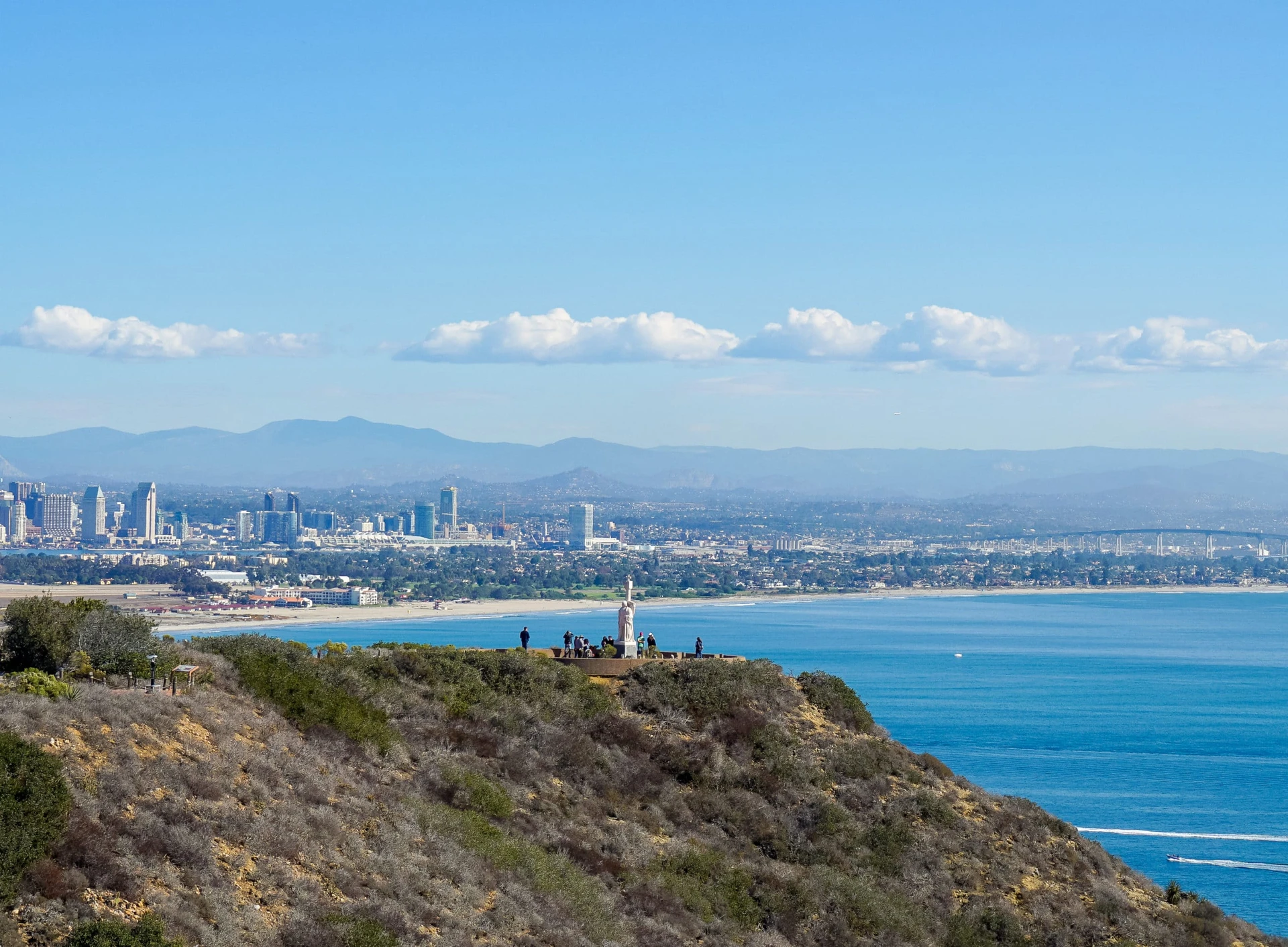 View over the Cabrillo statue to the bay and Coronado Bridge.