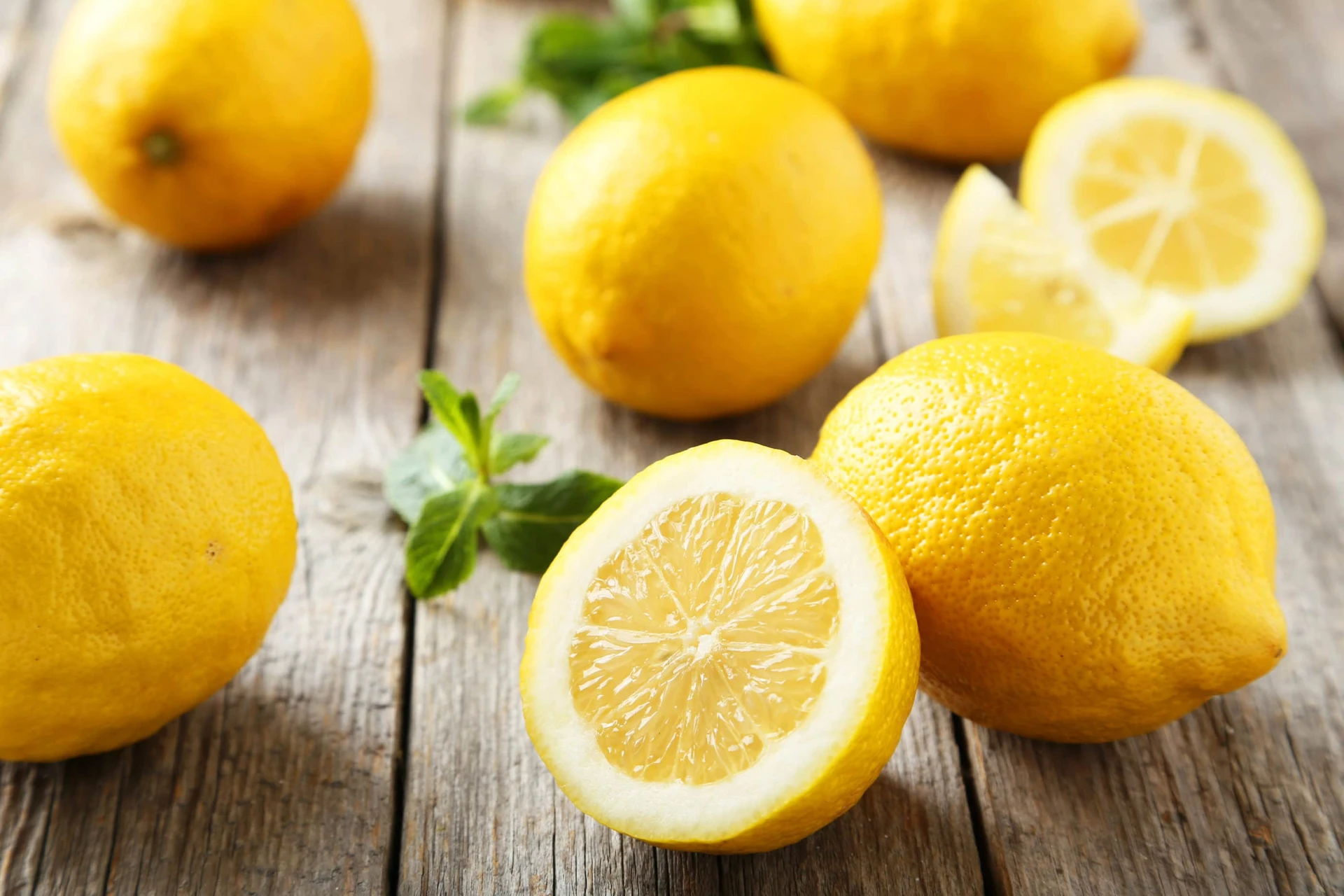 Pretty lemons on a wooden background.