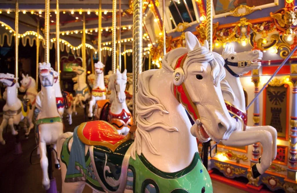 Close-up of a white horse on the King Arthur Carousel, a popular Disneyland ride for kids.