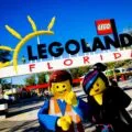 The LEGO Movie characters stand in front of the entrance to LEGOLAND Florida