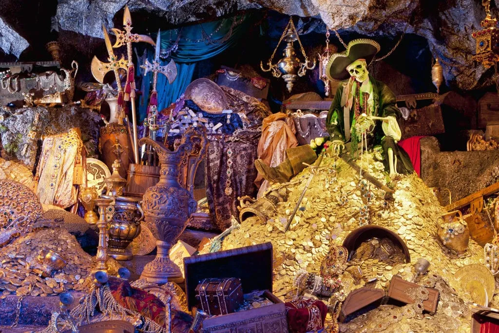 A skeleton sits in treasure on Pirates of the Caribbean, one of the most popular Disneyland rides.