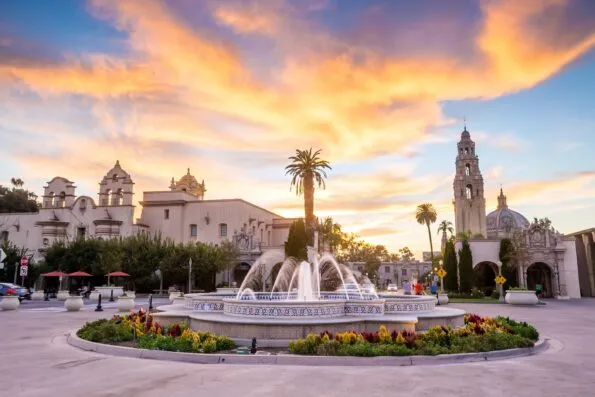 The California Tower, Mingei Museum and central Balboa Park fountain at sunset.