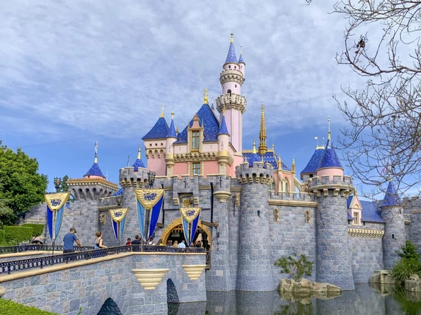 Guests walk through Sleeping Beauty's Castle at Disneyland.