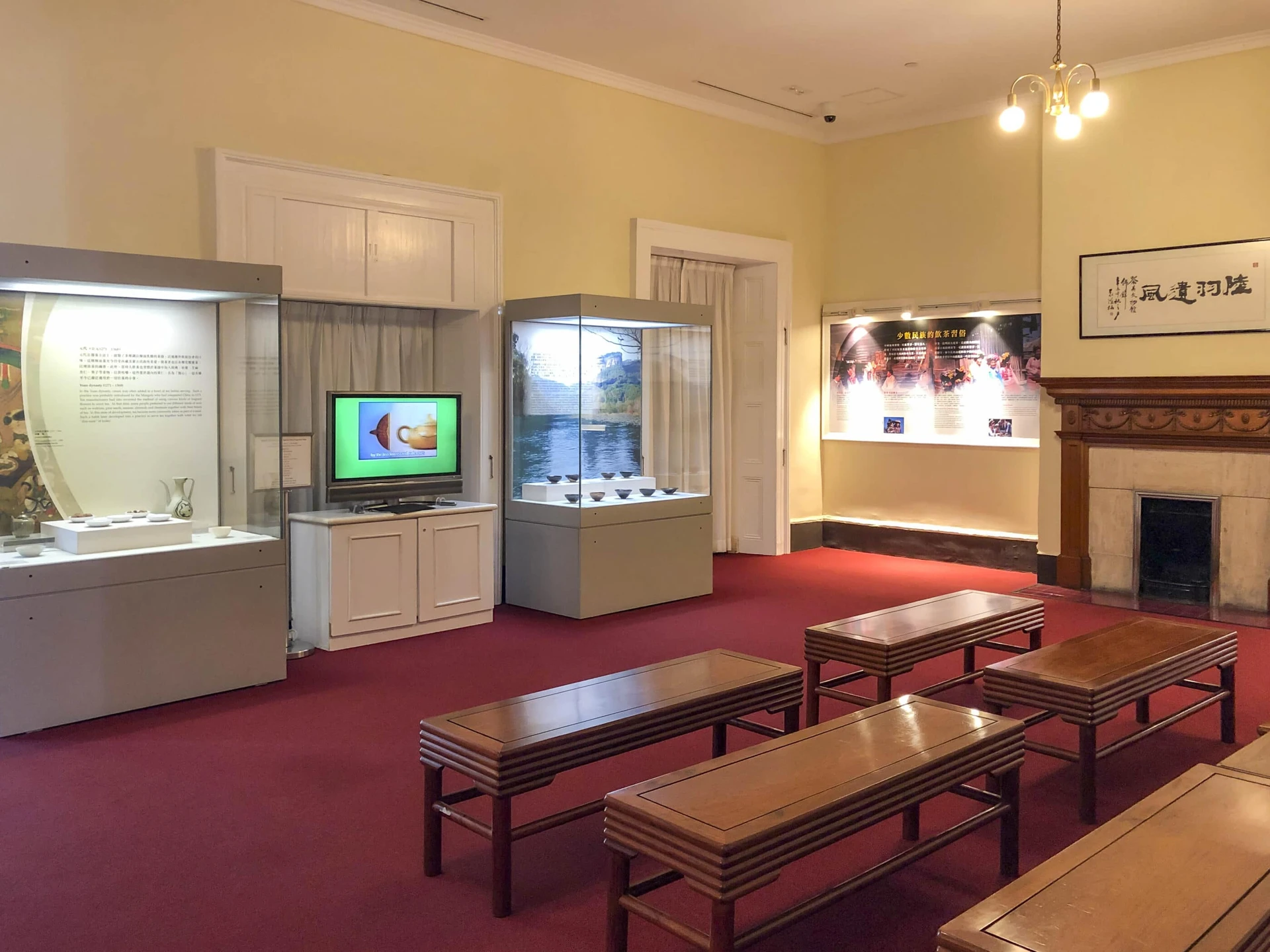 A teaware display and seating area inside the Flagstaff House Museum of Tea Ware in Hong Kong Park.