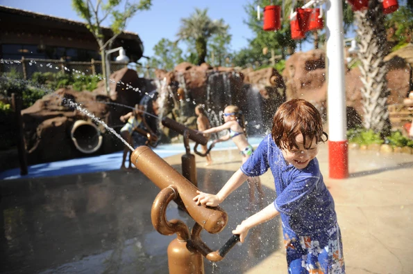 A child plays on the splash pad at Disney's Animal Kingdom Lodge.