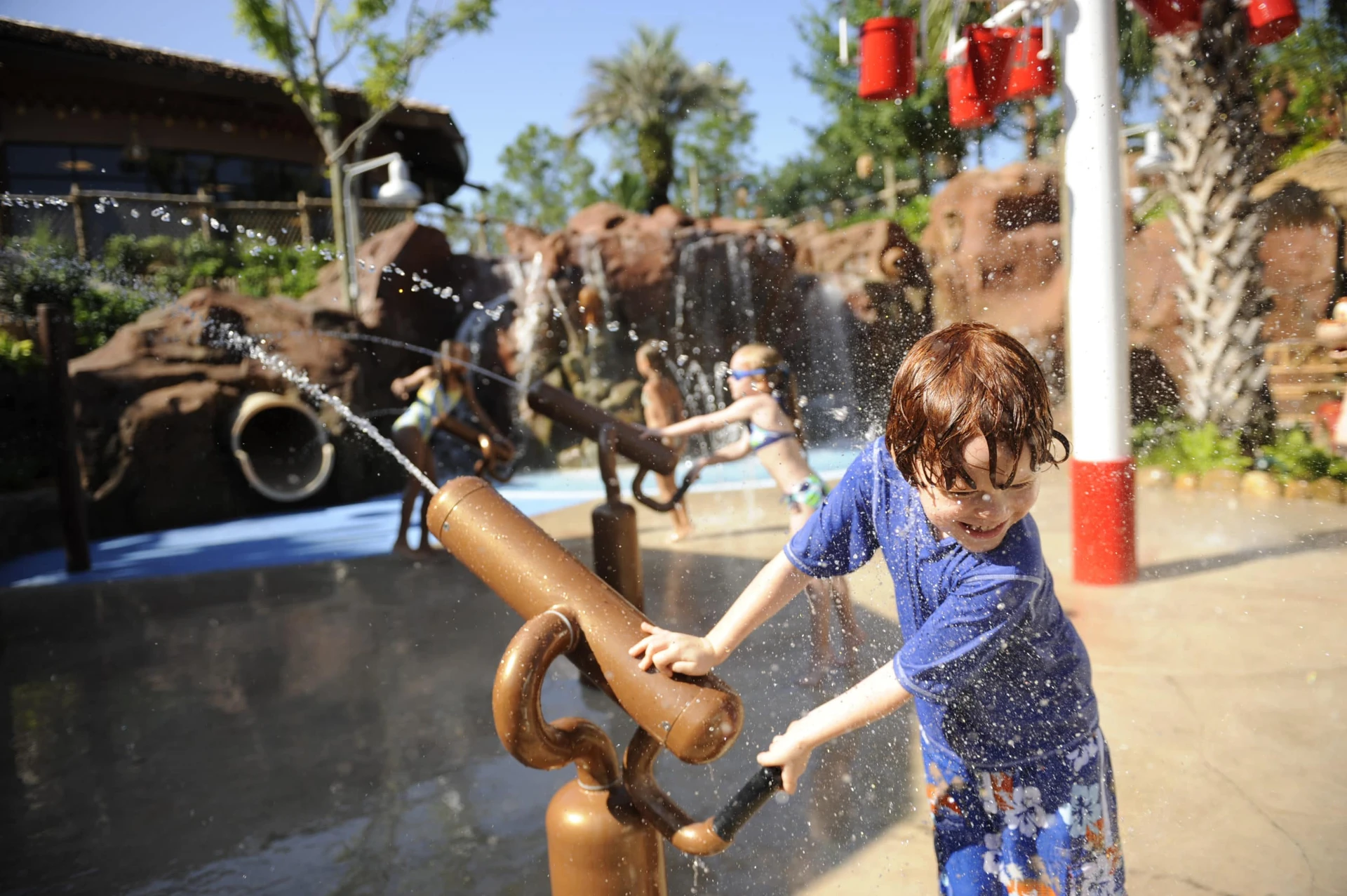 A child plays on the splash pad at Disney's Animal Kingdom Lodge.