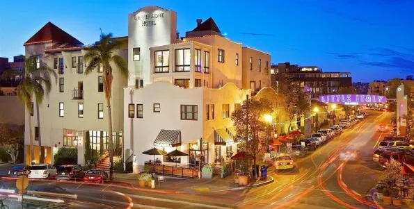 Exterior night view of La Pensione Little Italy San Diego hotel.