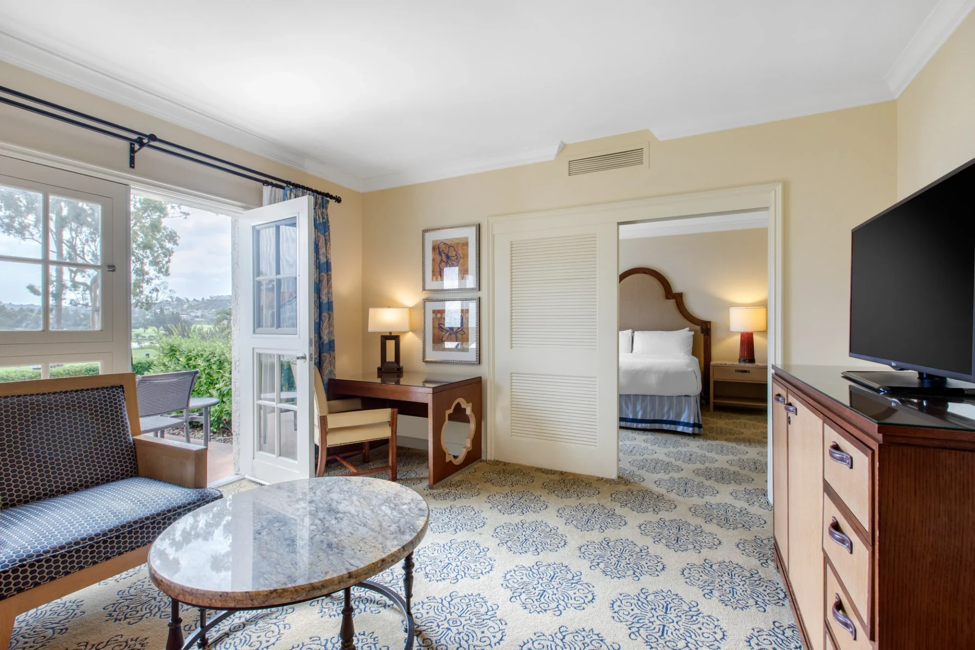 From from the living room of the La Costa Suite to the bedroom, which is separated by sliding perforated doors at Omni La Costa resort.