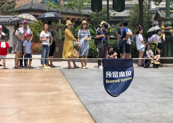 Reserved seating sign at a Shanghai Disneyland parade.