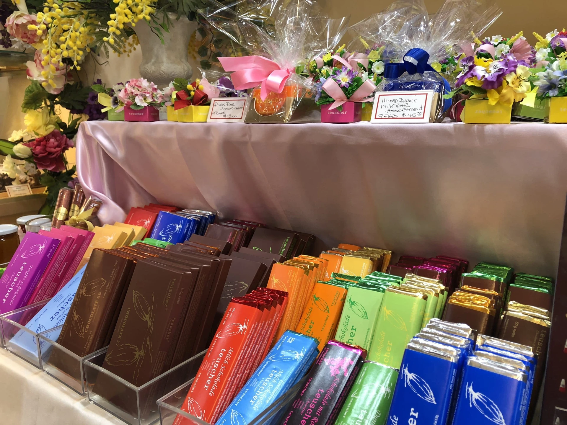 Teuscher bars of chocolate and wrapped gifts to easily take away.