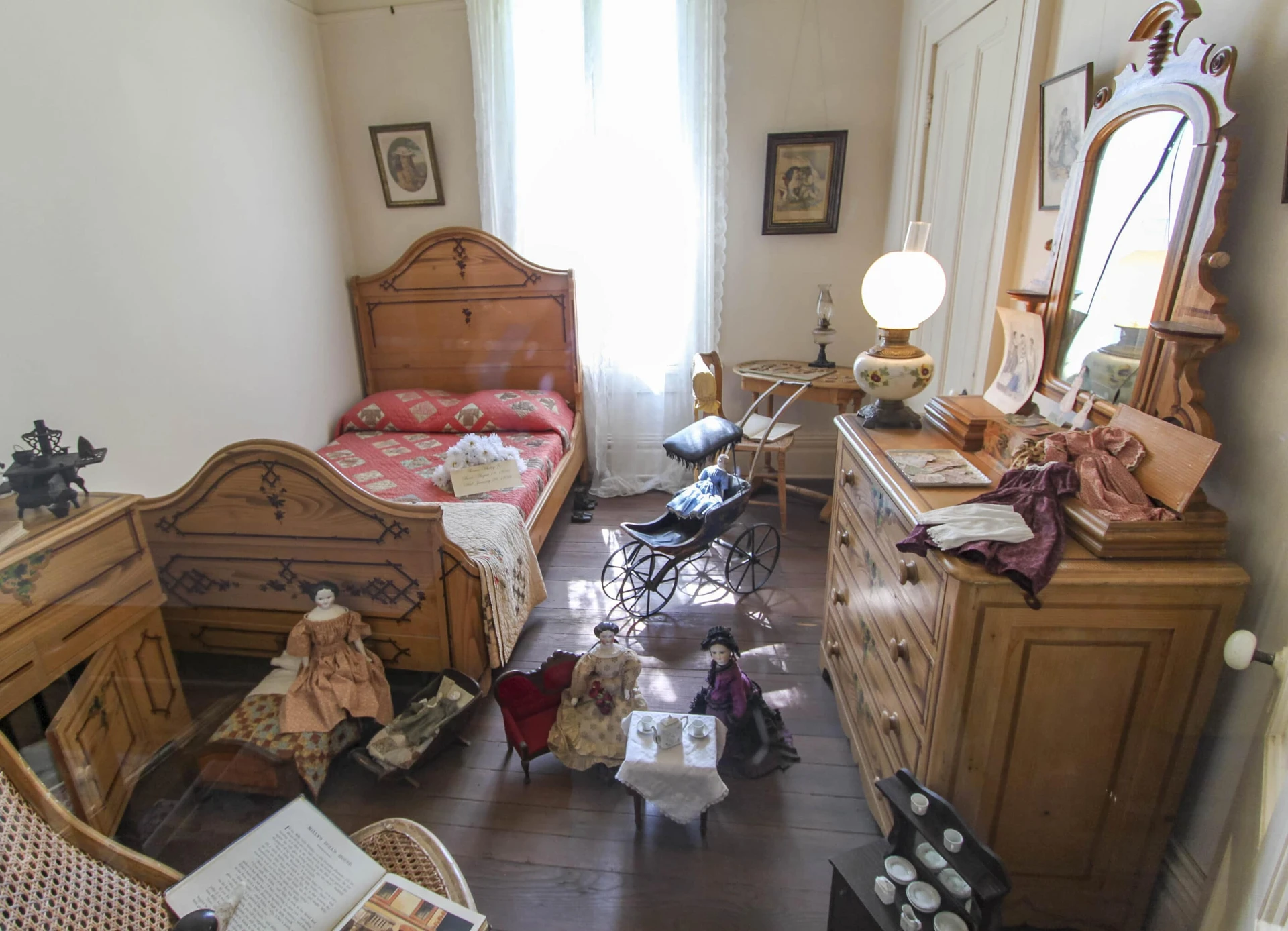 Antique furniture in a bedroom inside Whaley House in San Diego.