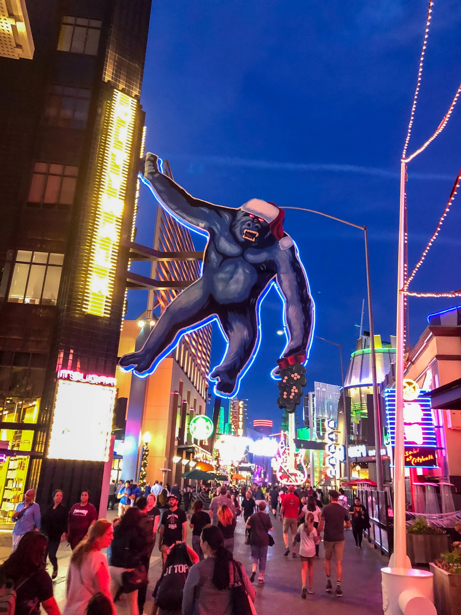 Universal Citywalk entertainment area filled with people at night.