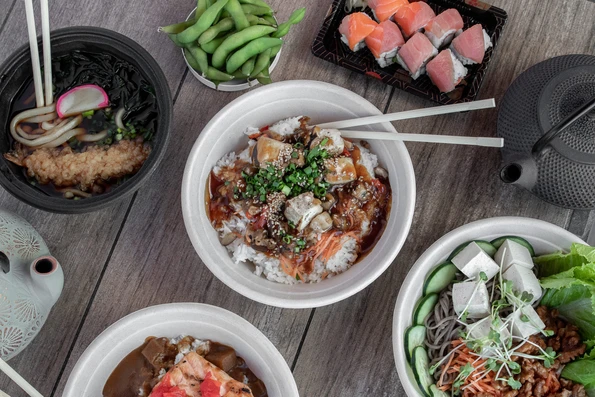 A selection of dishes from Tea Pavilion in Balboa Park on a wooden table.