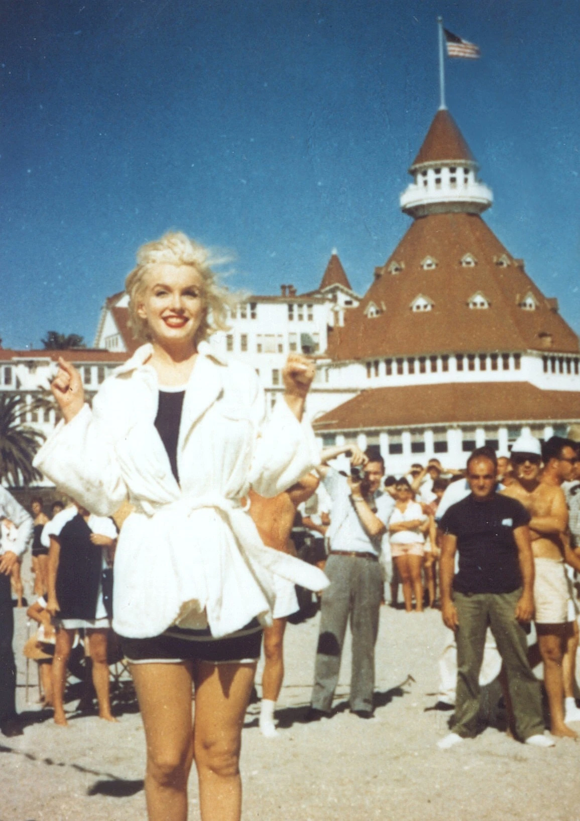 Marilyn Monroe stands in a white shirt in front of Hotel del Coronado.