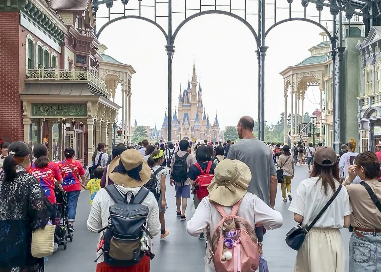 People walk into Tokyo Disneyland through World Bazaar.