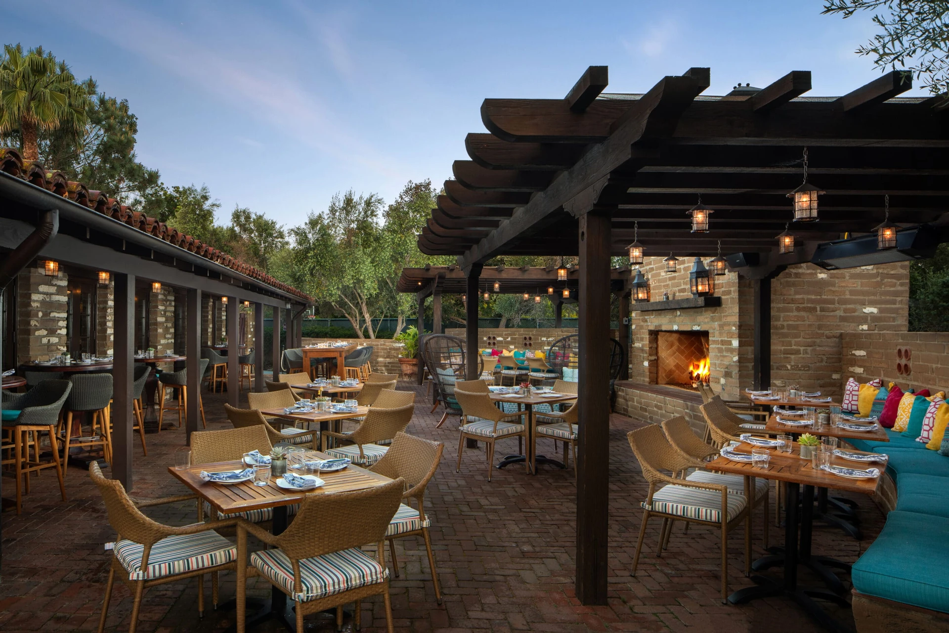 The outdoor patio with fireplace at Mustangs & Burros