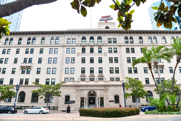 The Renaissance-style exterior with vintage YMCA sign on the roof.