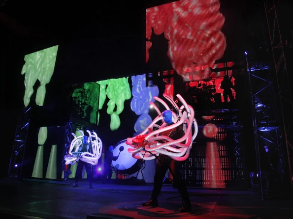 One of the Blue Men plays a crazy instrument during a performance.