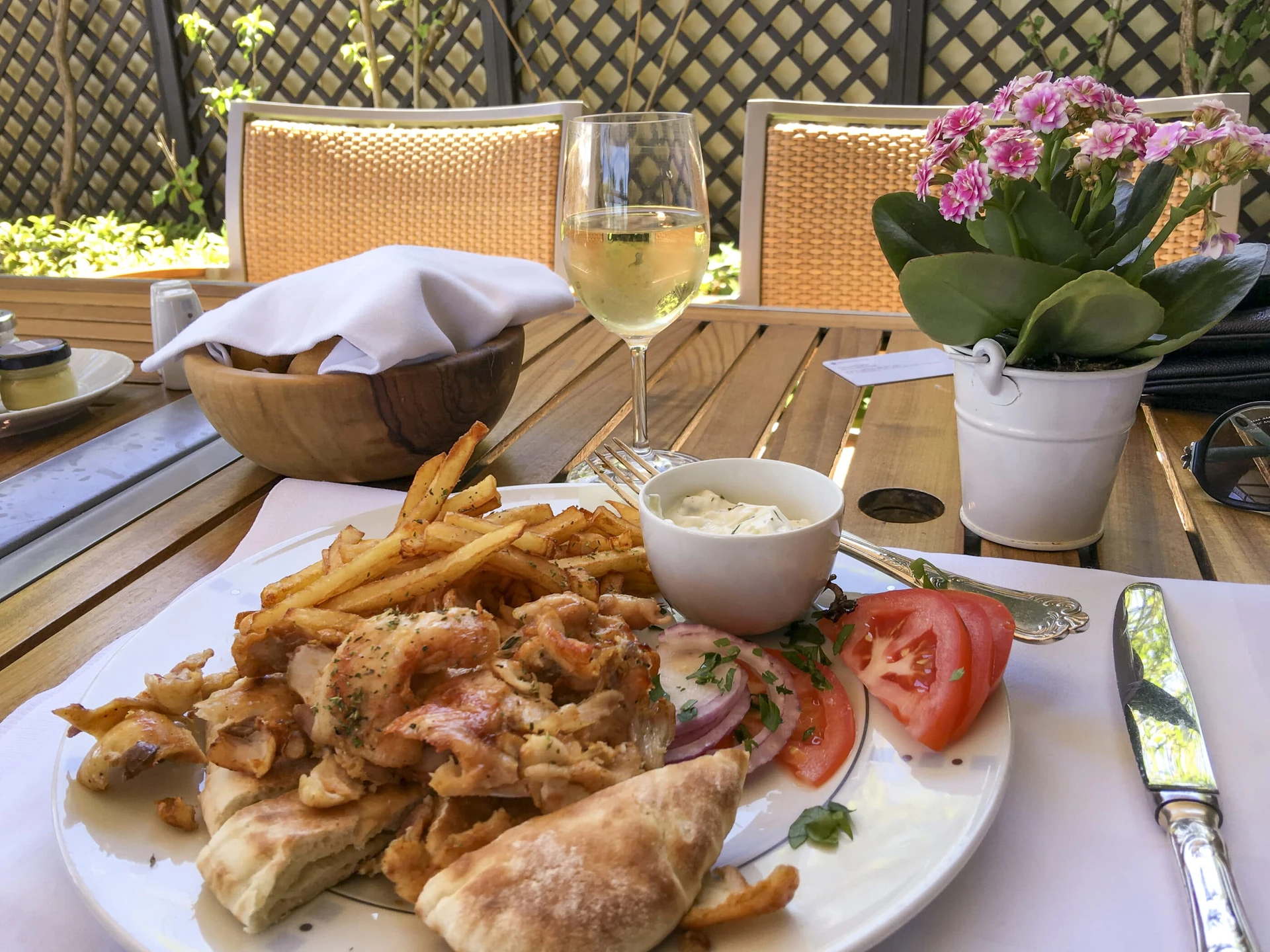 A plate of chicken souvlaki at GB Grill by the pool.