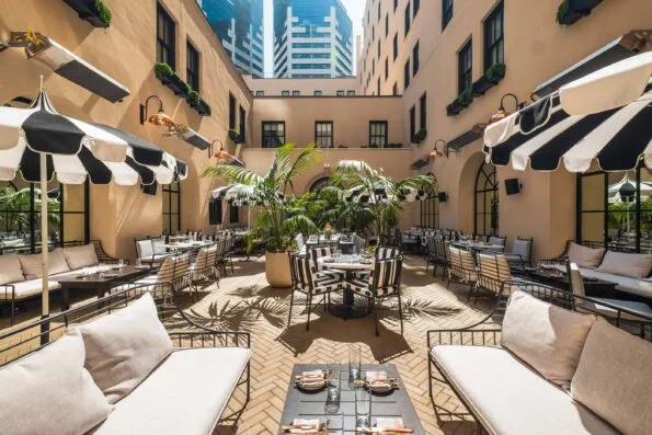 Al fresco dining at Luca Restaurant in a courtyard at The Guild Hotel San Diego.