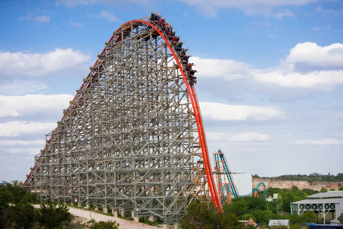 The Iron Rattler roller coaster at Six Flags Fiesta Texas hurls down a steep drop.