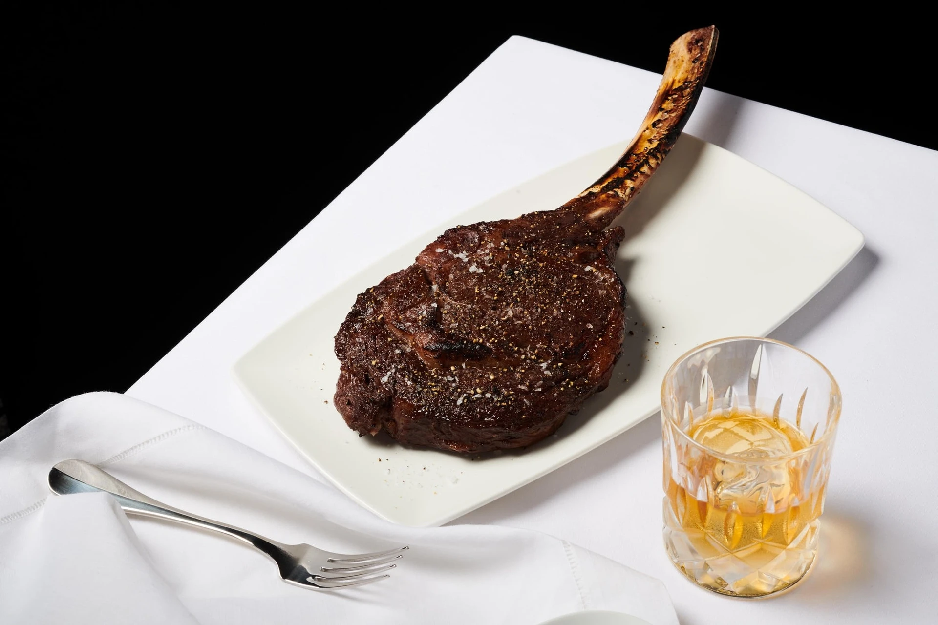 Steak on a white plate at Del Frisco's.