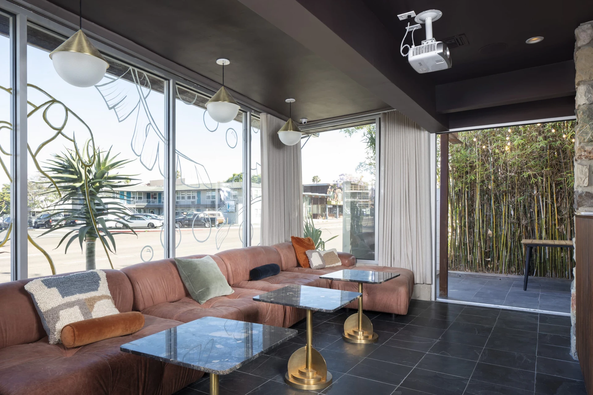 The lounge in the front of the hotel with a view of Rosecrans Street in the background.