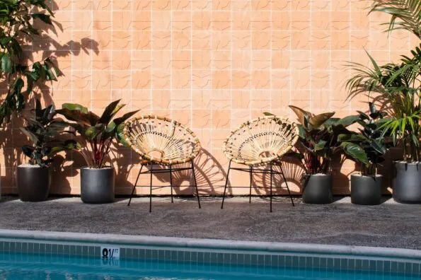 Two chairs by the pool at The Pearl Hotel San Diego.