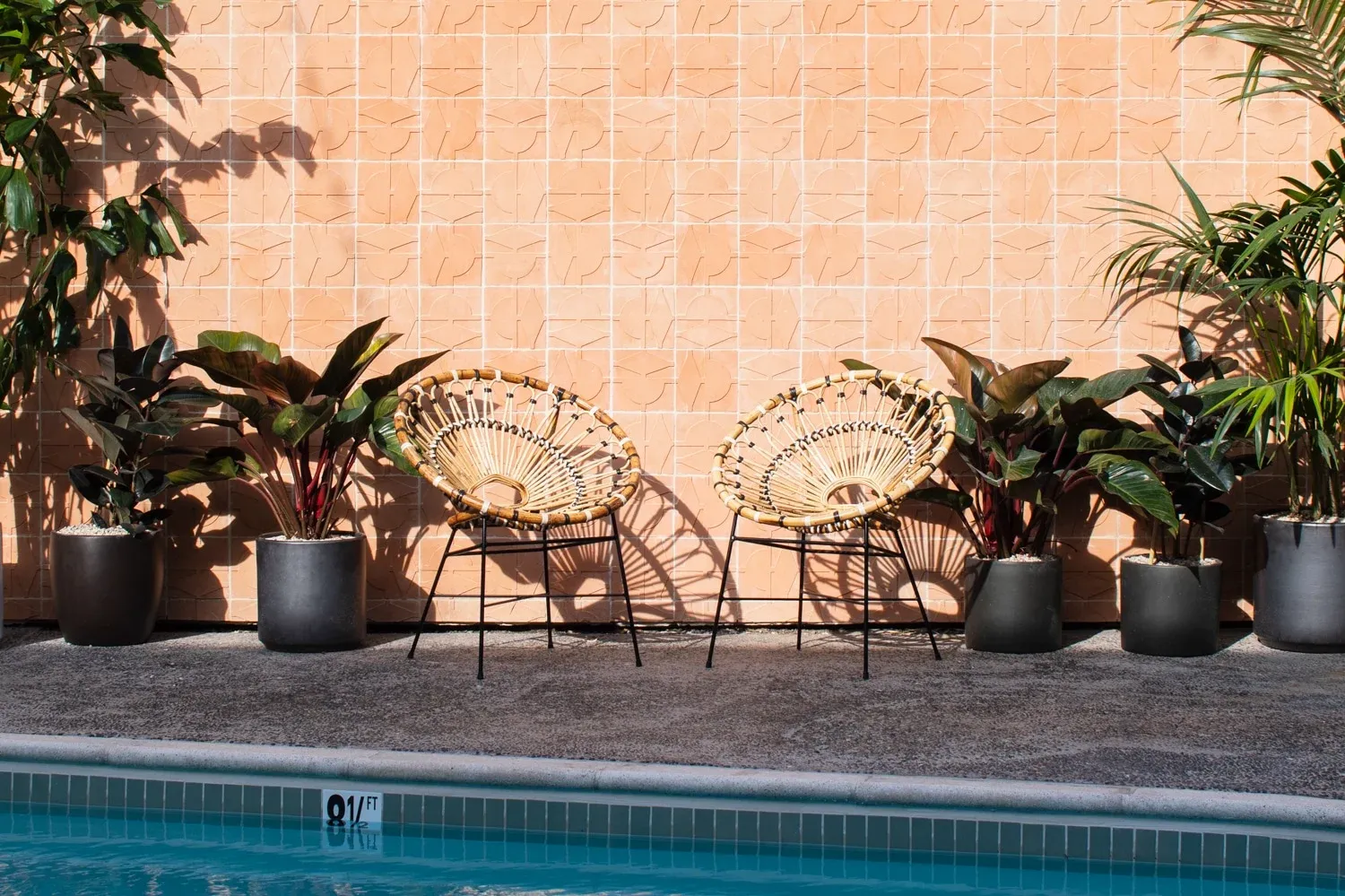 Two chairs by the pool at The Pearl Hotel San Diego.