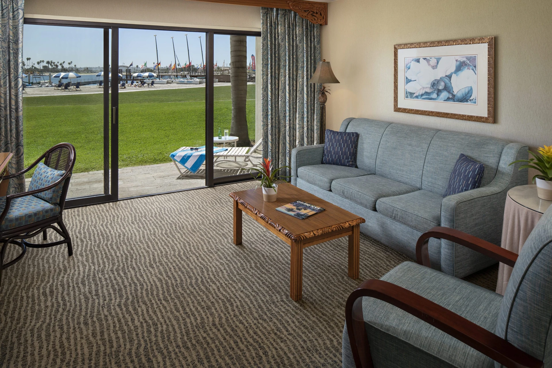 Living room of a Bay Front Suite illustrating that you can walk directly out from your room to the bay beach.