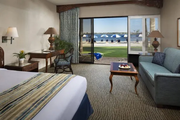Bay Front room showing direct walk-out access to the chairs and umbrellas on the beach.