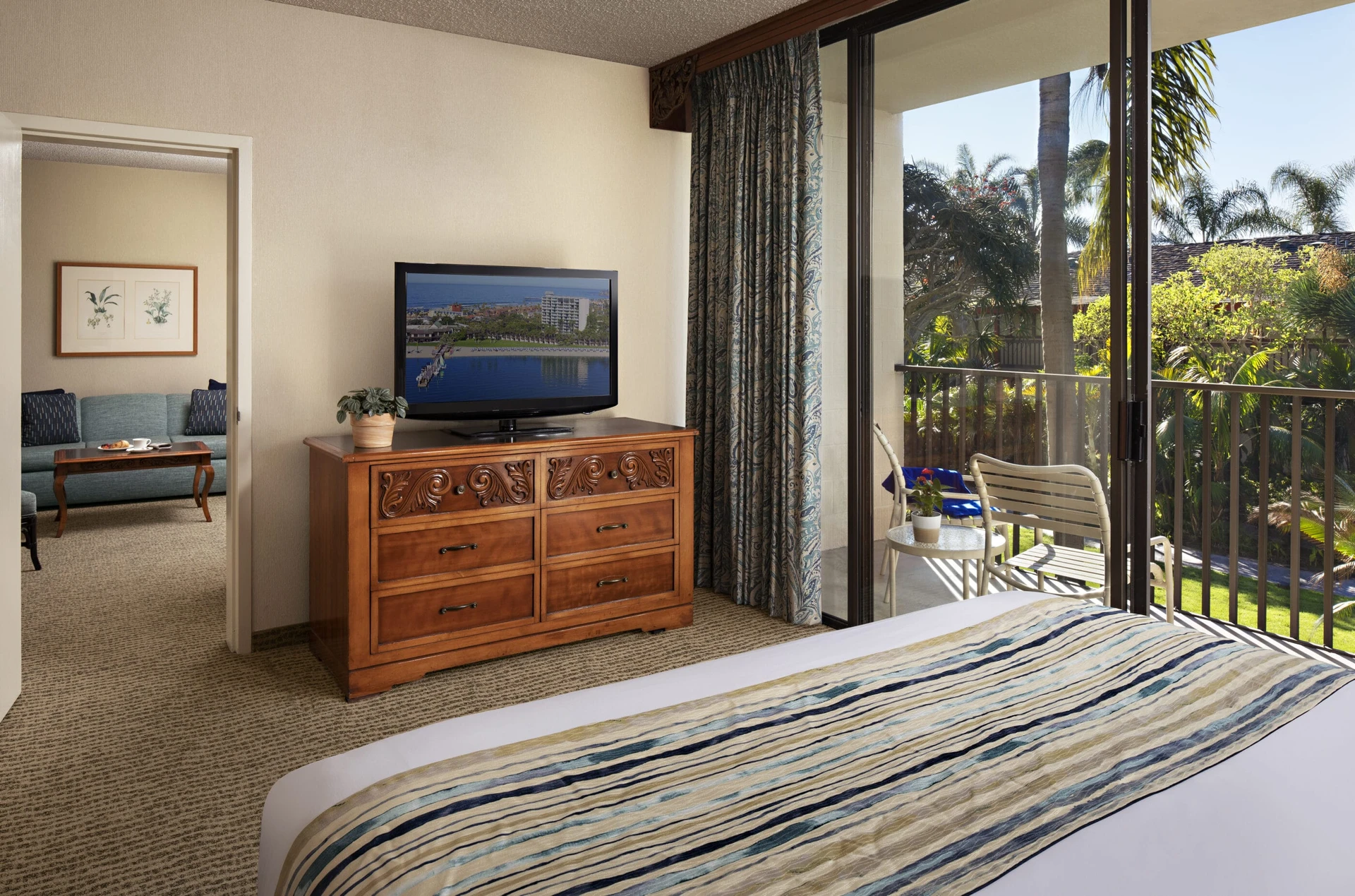 The bedroom closes off from the living room in the Garden View Suite.