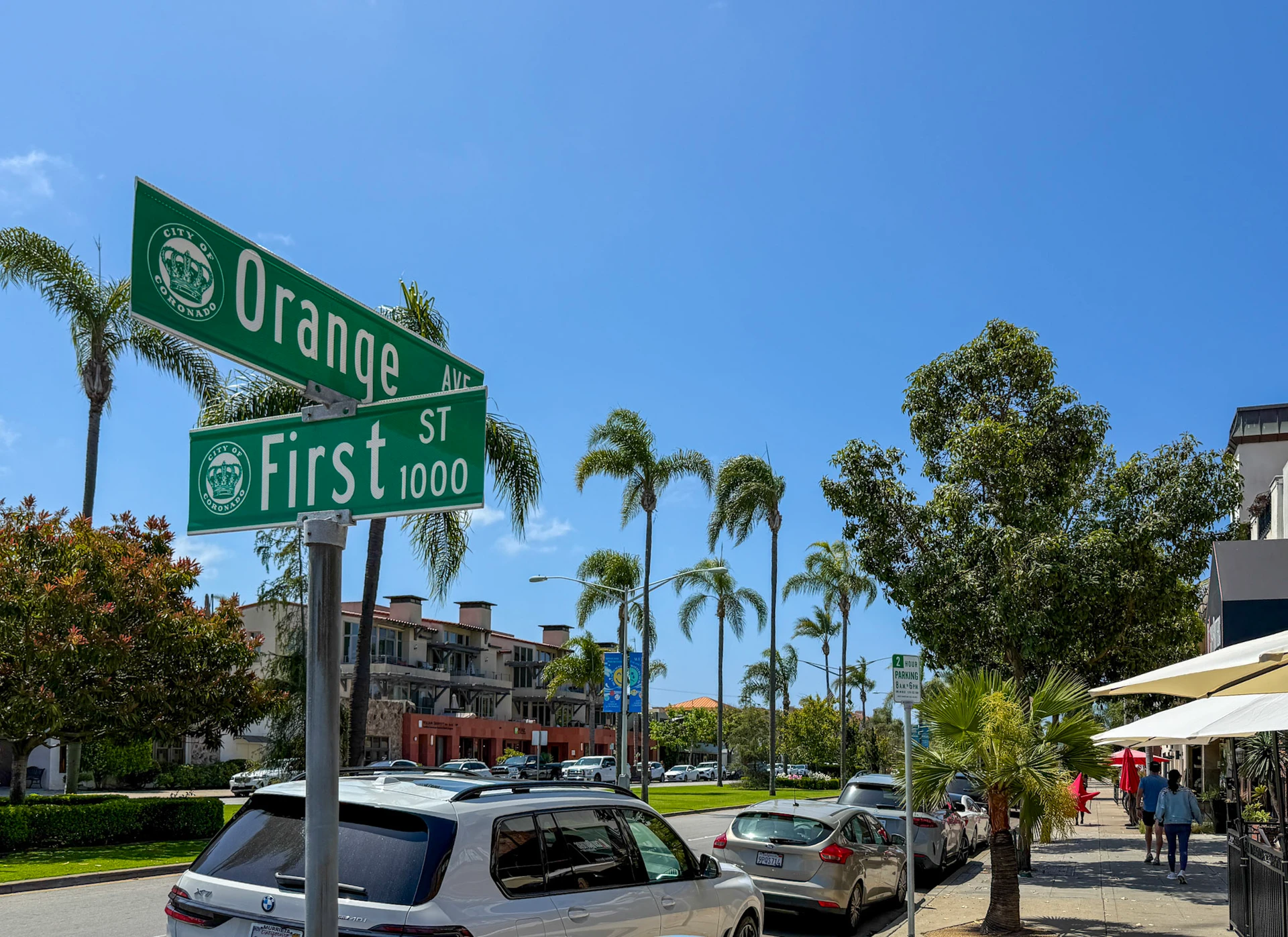 Orange Avenue and First Street signs in Coronado on a sunny day.