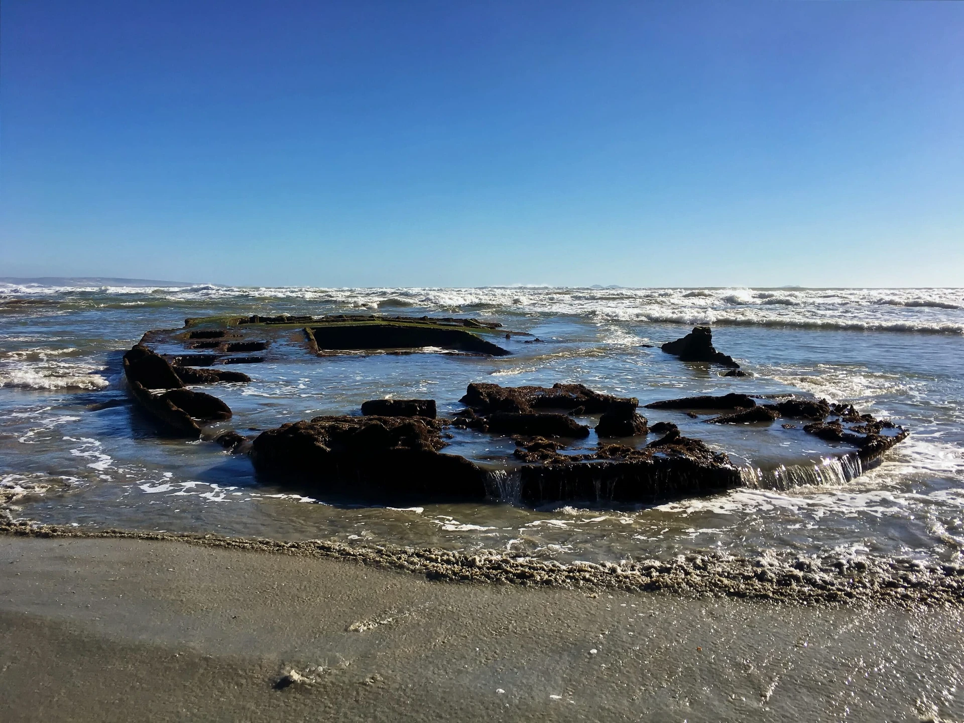 SS Monte Carlo Coronado shipwreck revealed on the beach during low tides.