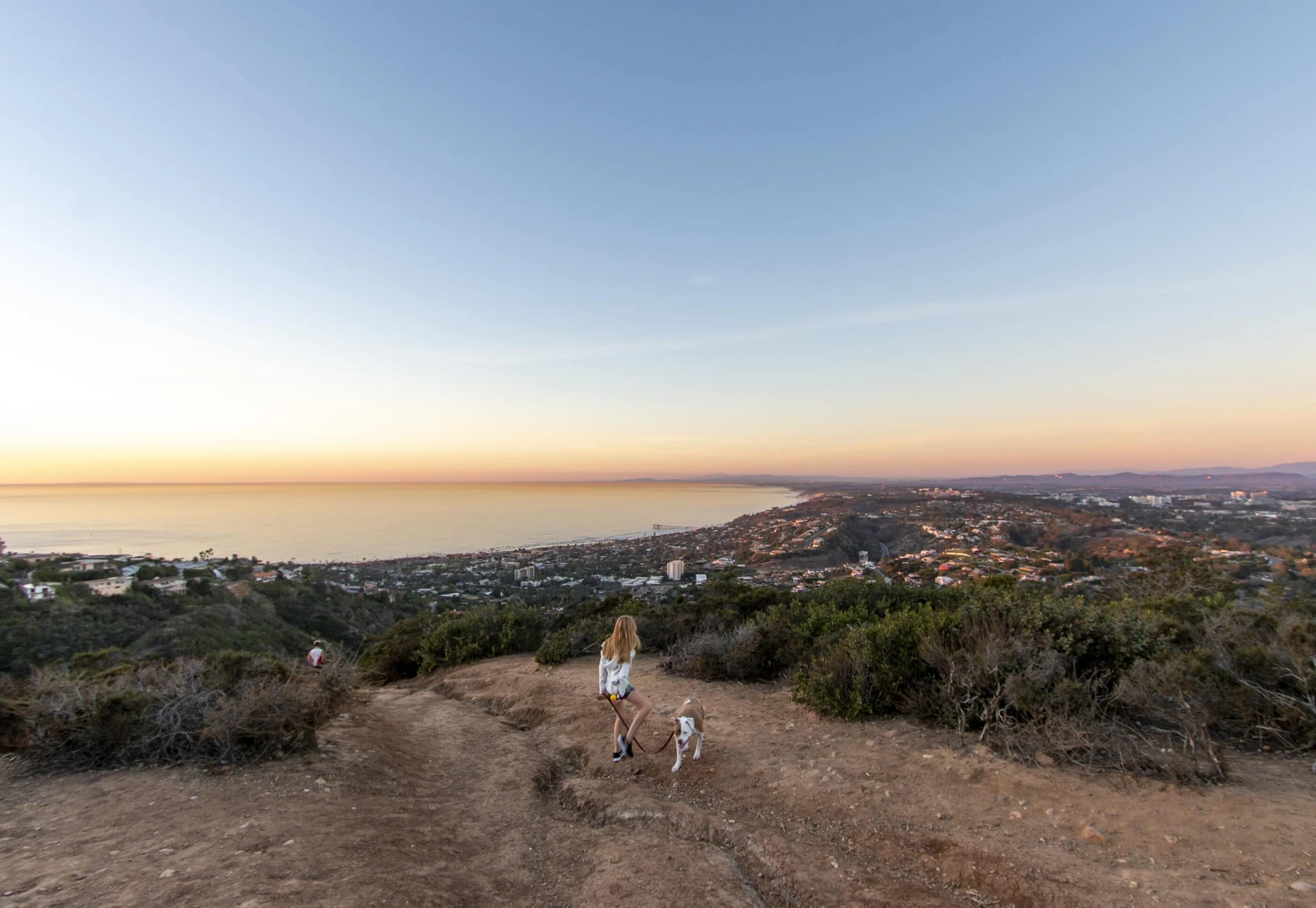 My daughter walks our dog on one of the Mount Soledad trails near the memorial.