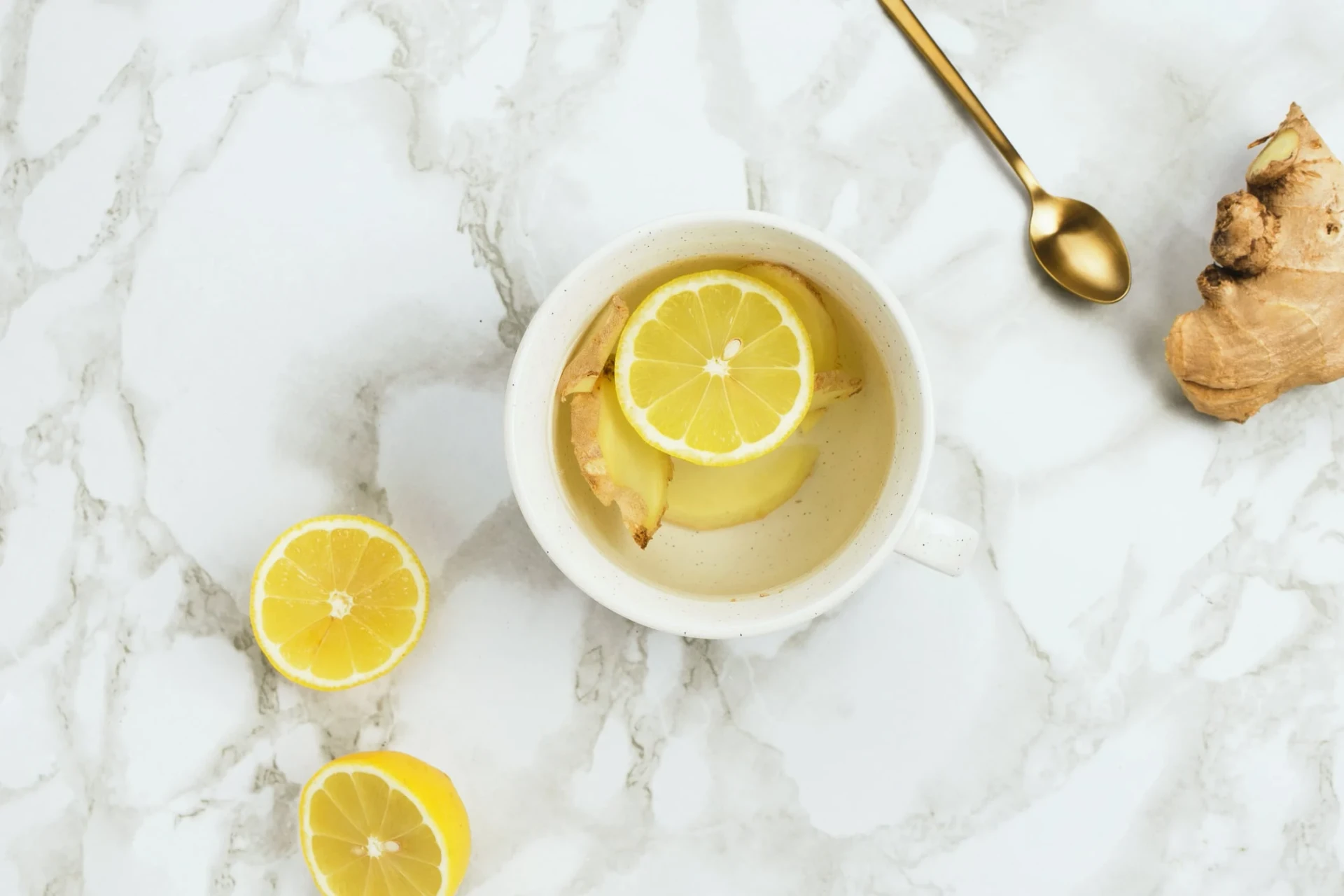 Warm lemon water with fresh sliced ginger in it.