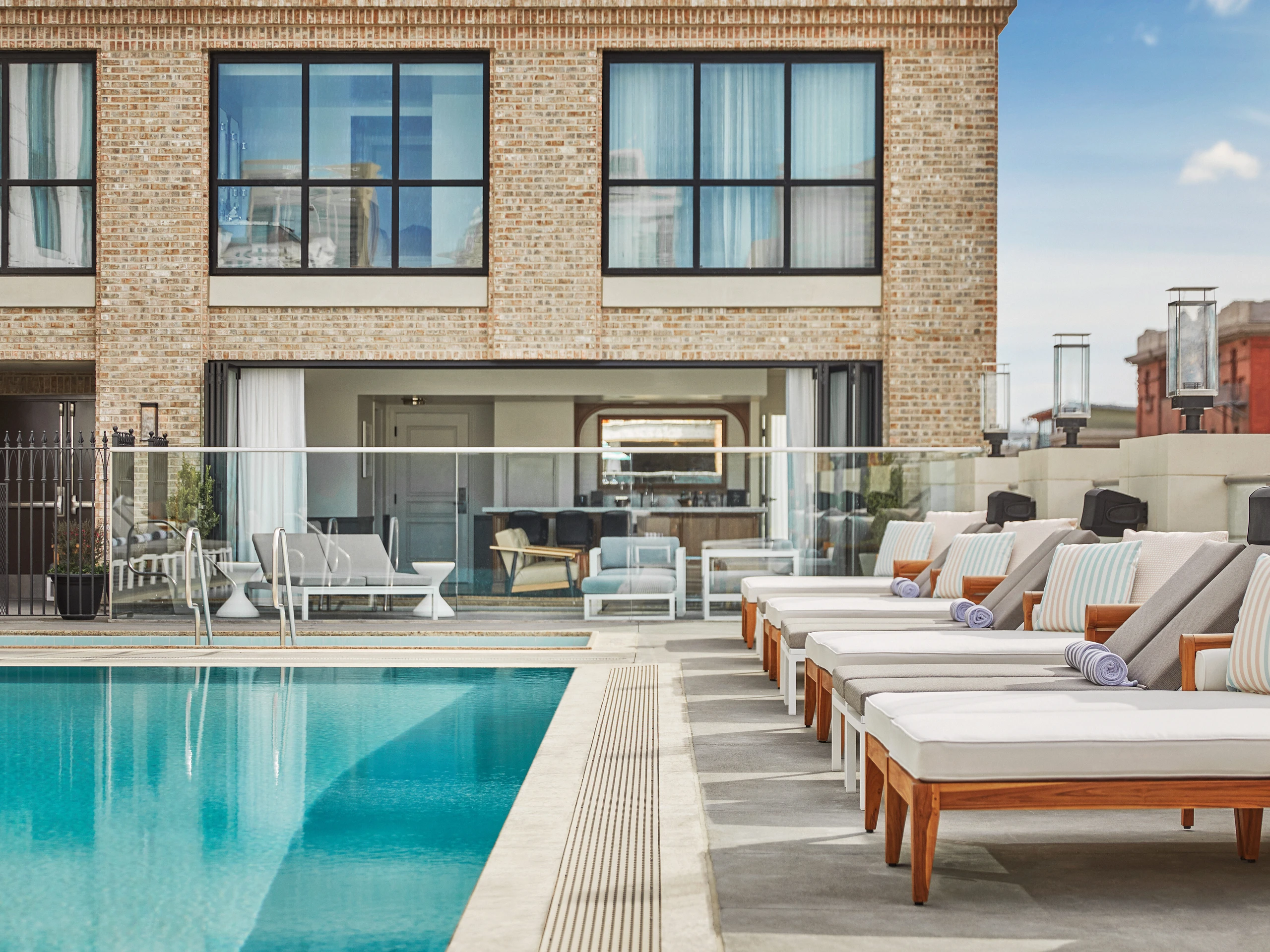 Lounge chairs surround the pool at Pendry San Diego hotel.