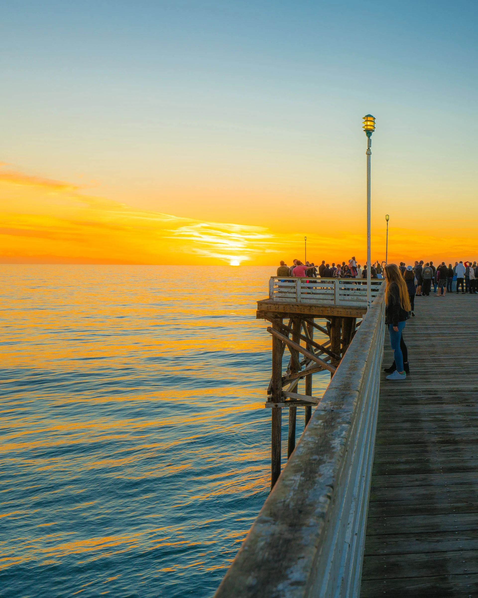 Sunset at the end of Crystal Pier in Pacific Beach.