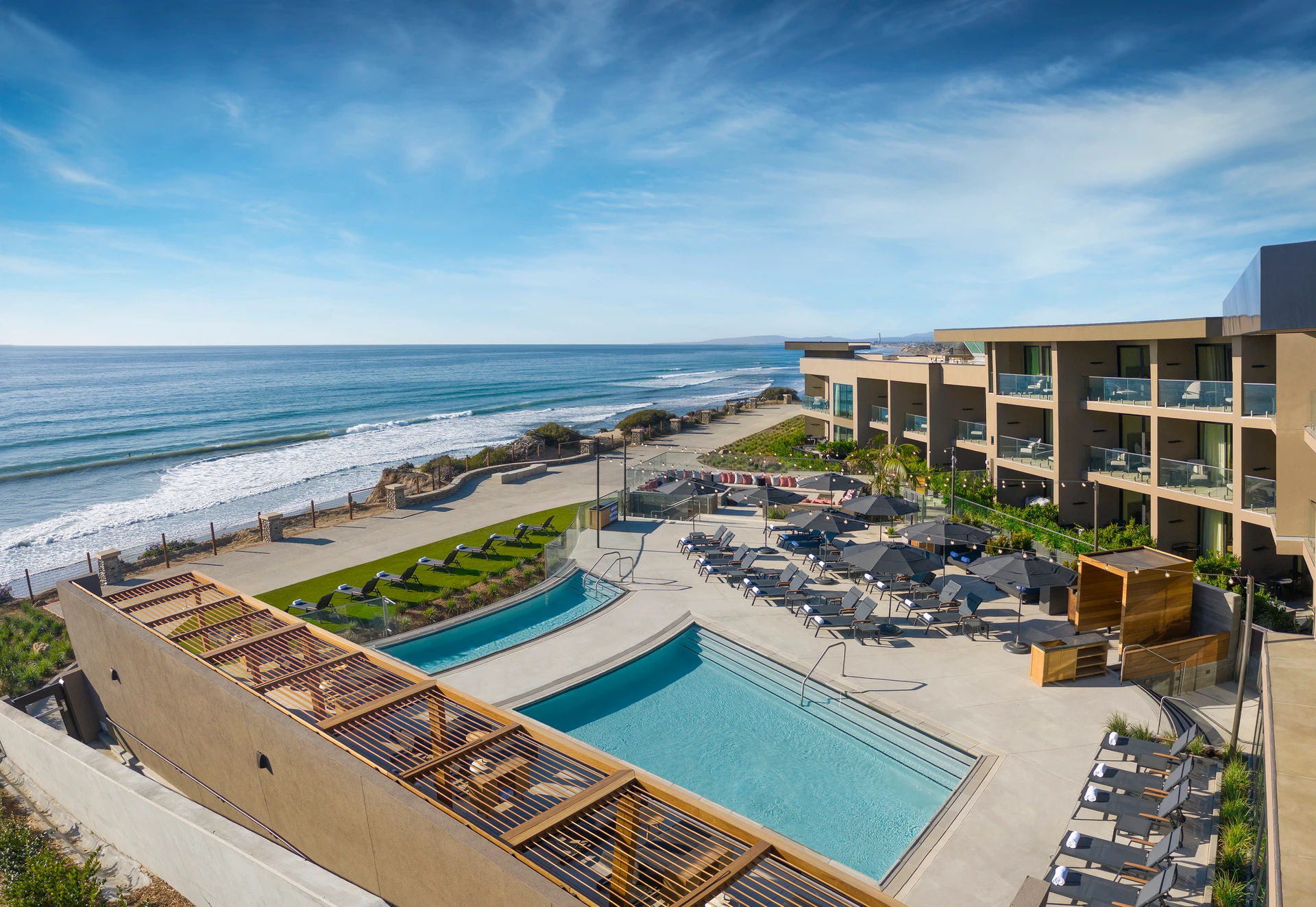 Aerial view of the outdoor swimming pool overlooking the ocean.