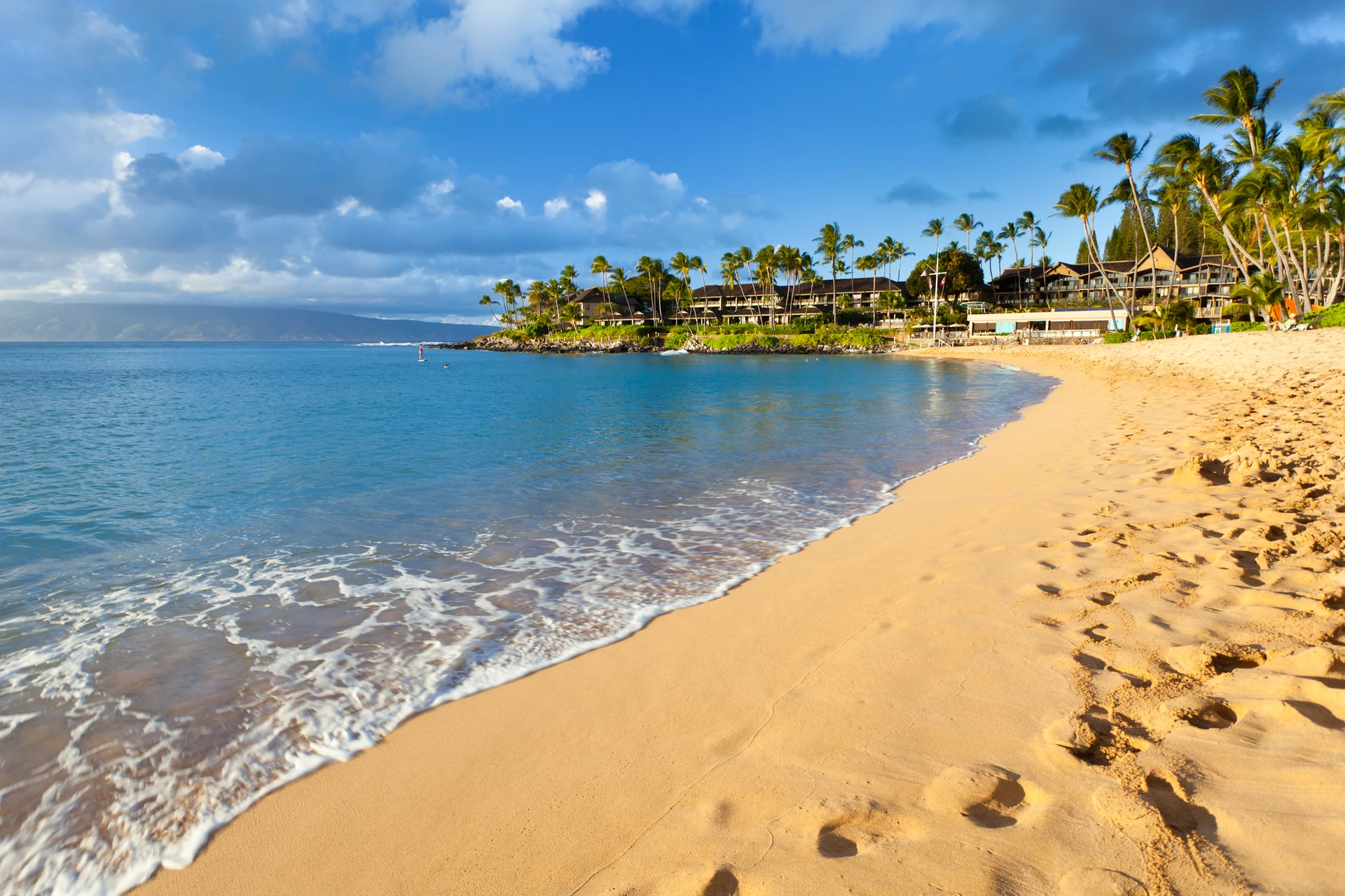 Ocean water washes up on Napili Bay beach.
