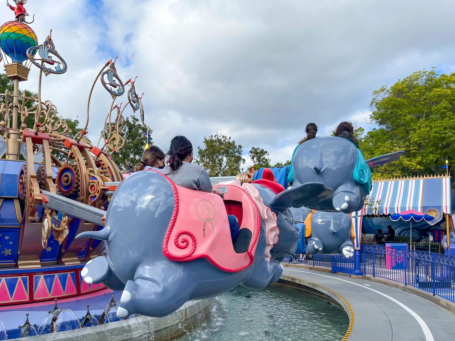 Families ride Dumbo at Disneyland.
