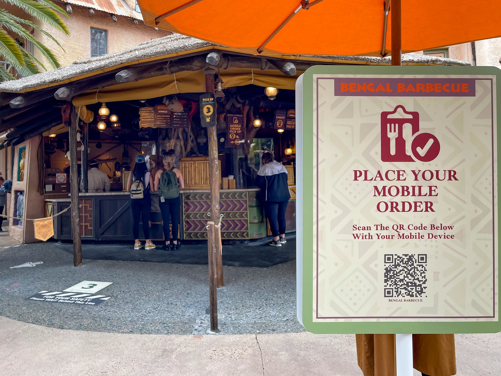 Disneyland mobile ordering sign in front of Bengal Barbecue.